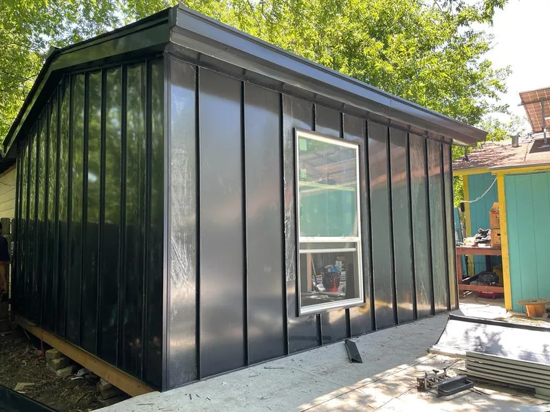 Black standing seam metal wall panels for Roof Inspection in Penitas