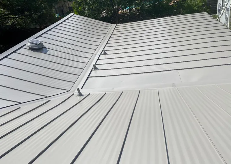 Solar attic fan installed on a metal roof for Roof Ventilation in Penitas